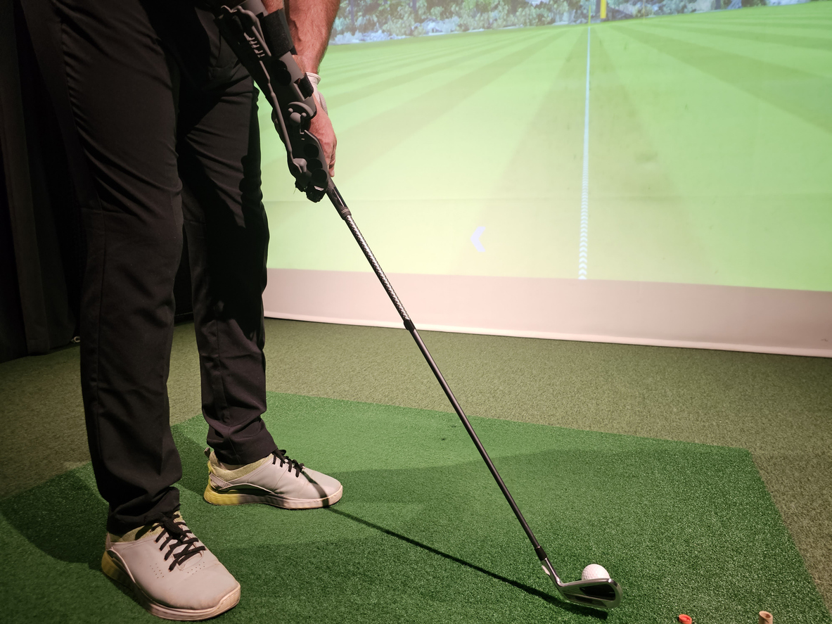 Golfer practicing proper swing with plastic golf grip concept